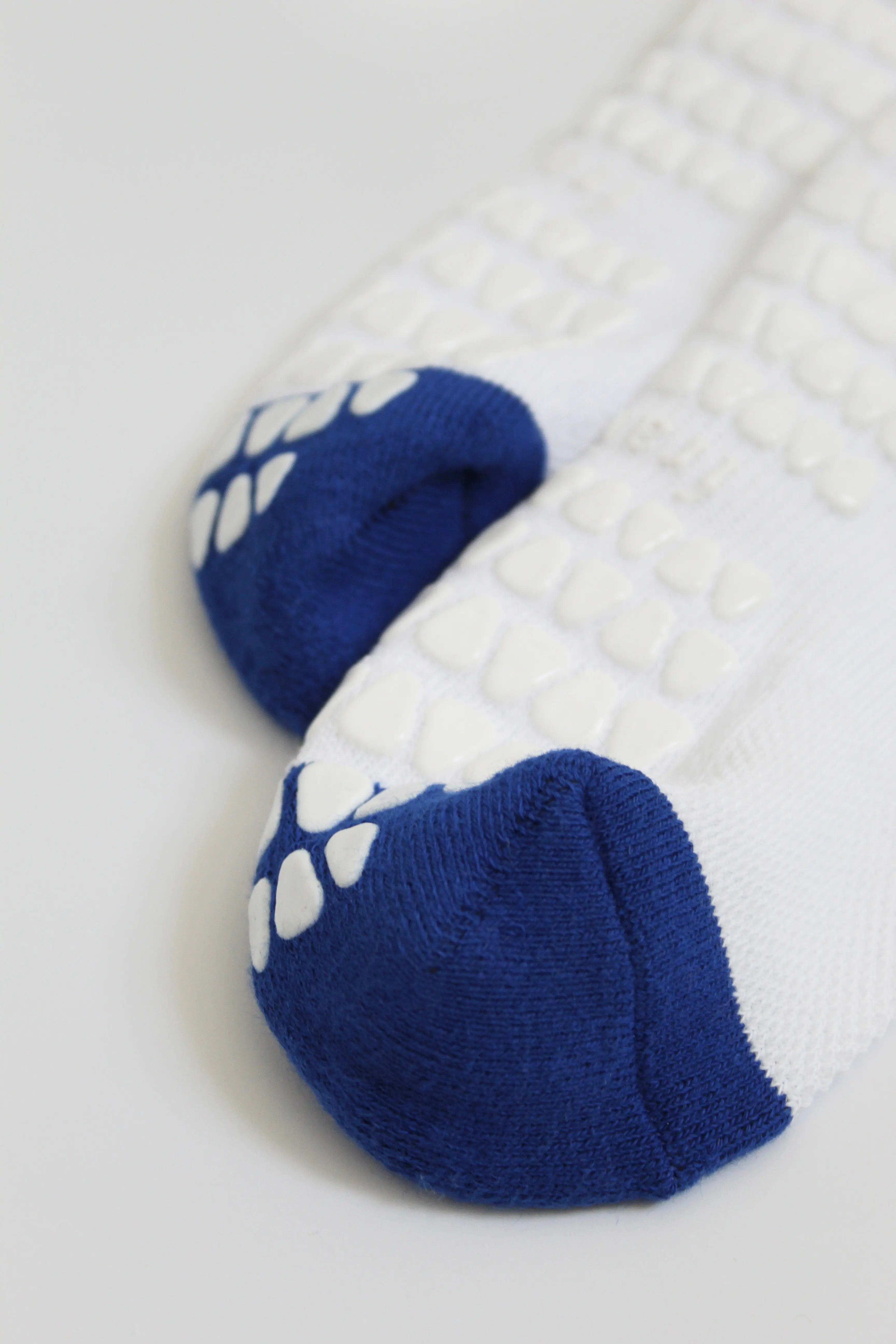 Pair of Fraise branded pilates grip socks in white and blue