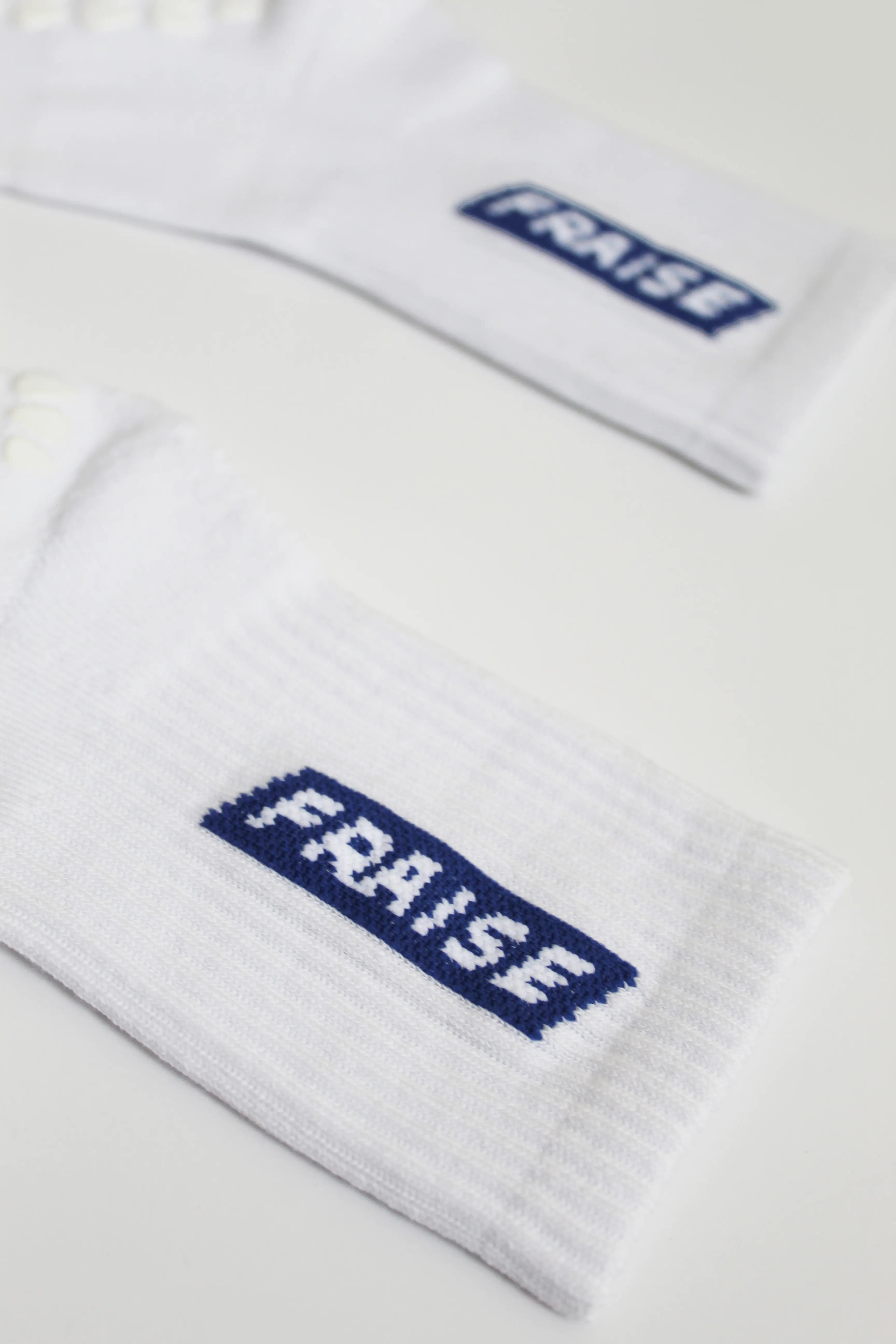 Pair of Fraise branded pilates grip socks in white and blue
