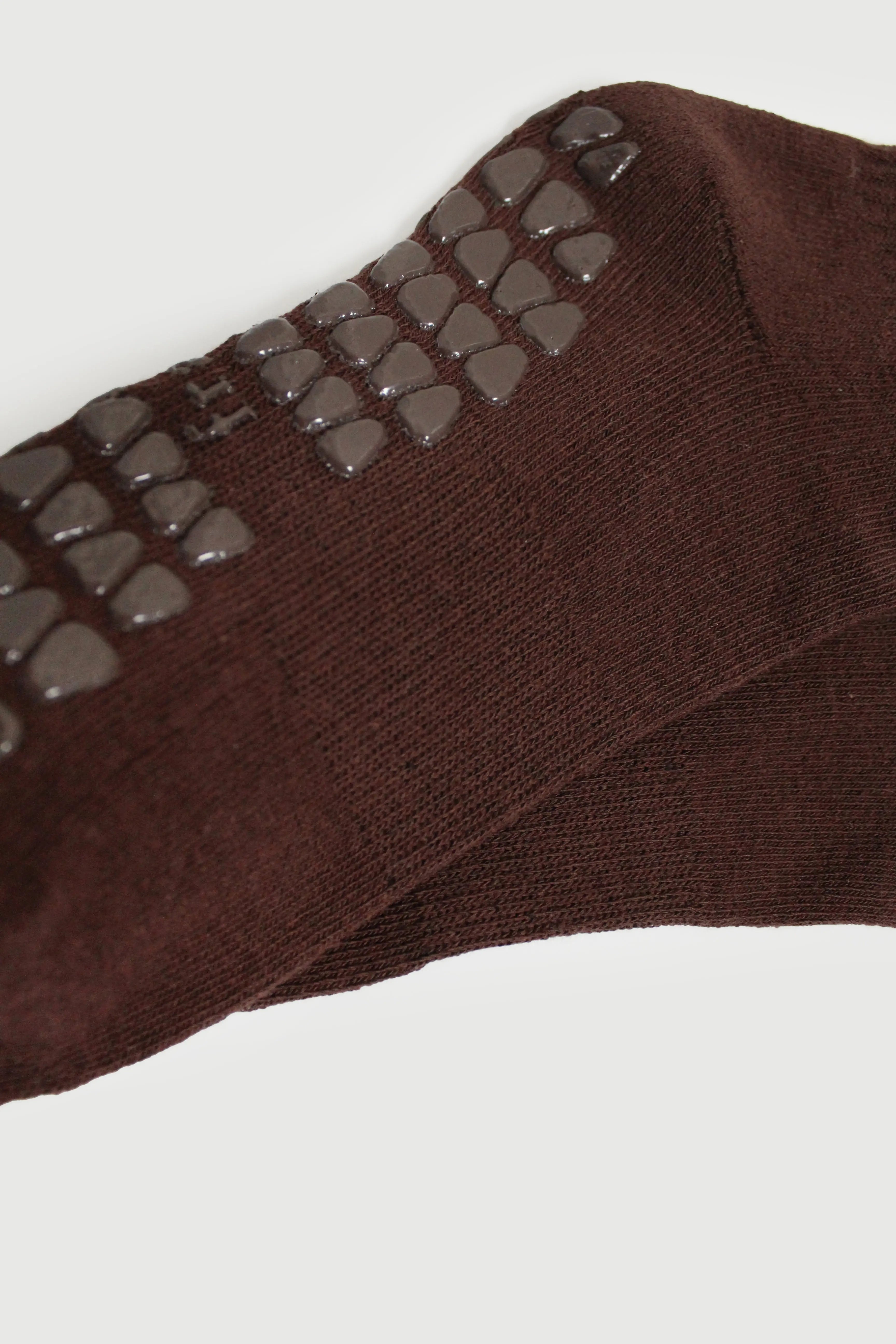 Pair of espresso brown pilates grip socks sole