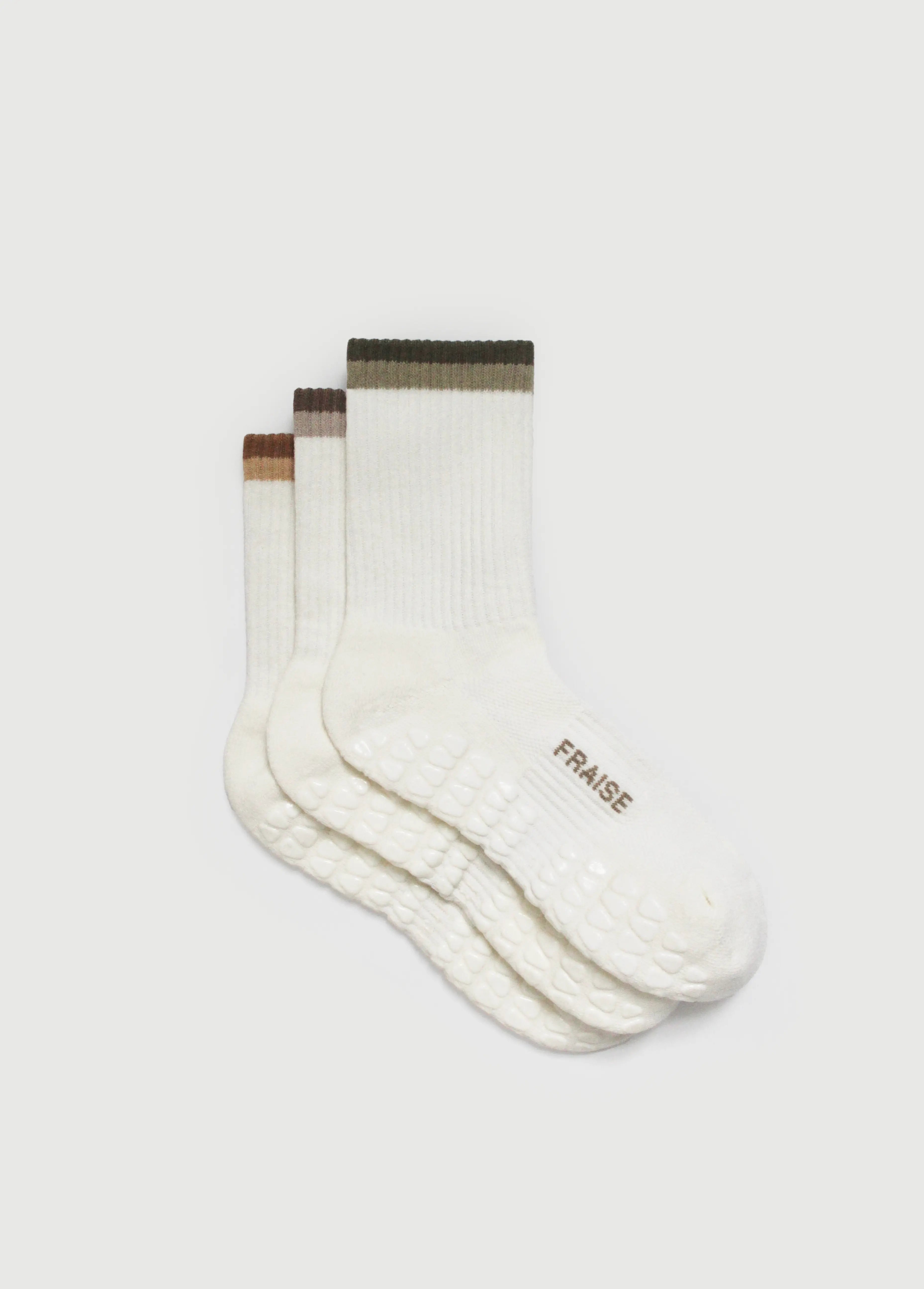 Set of three crew length pilates grip socks with stripes on cuff