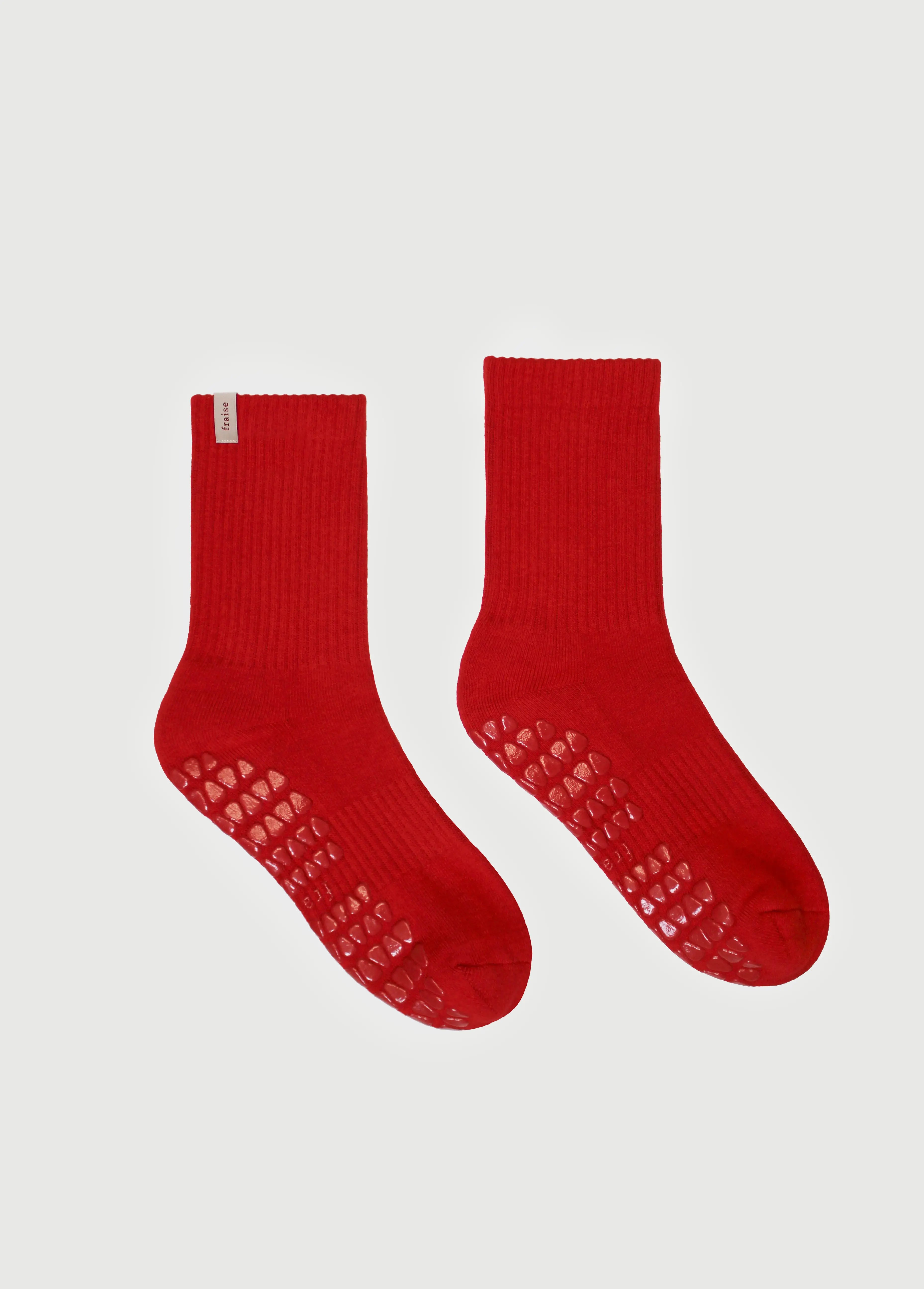 Pair of Fraise branded pilates grip socks in red