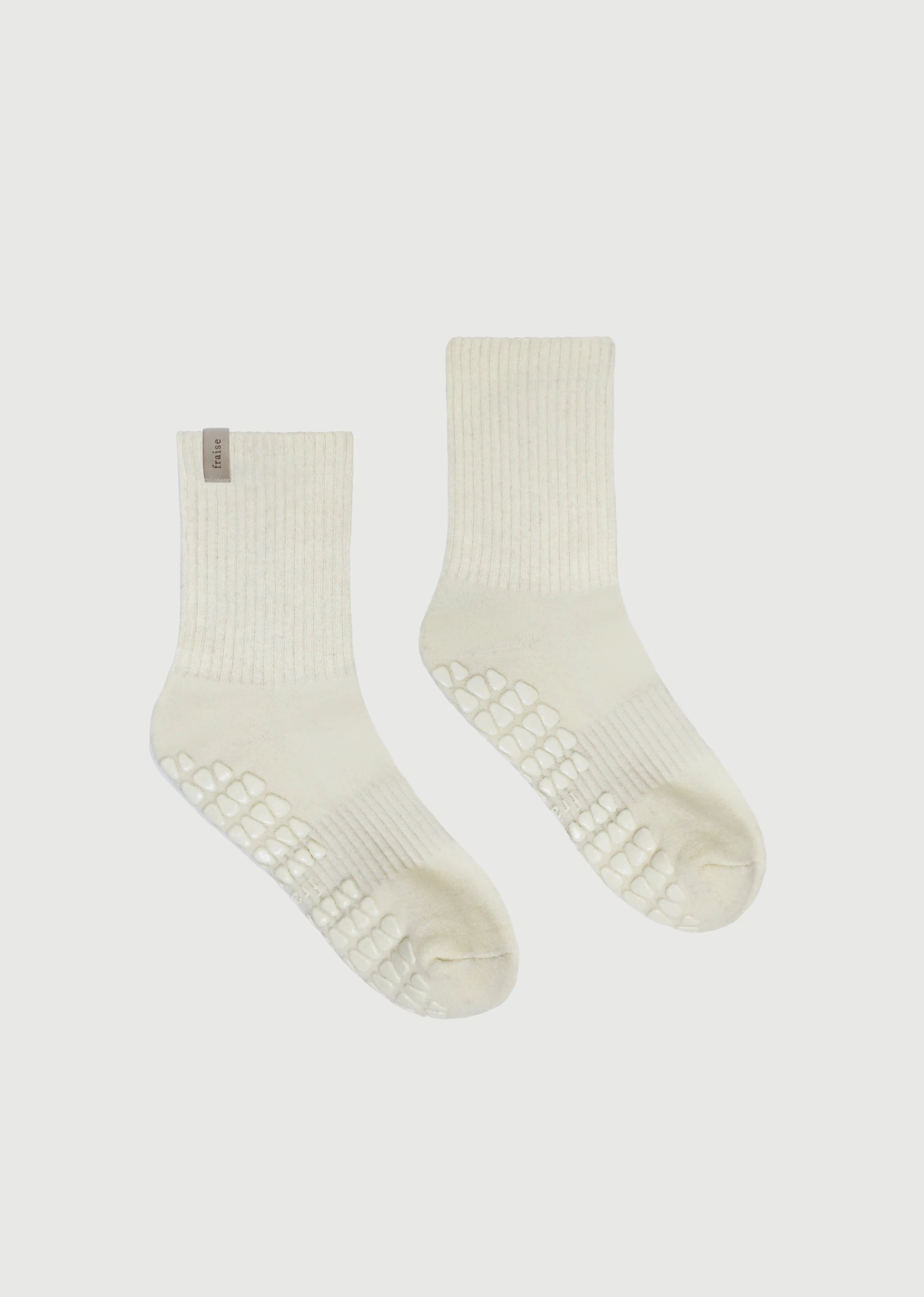 Pair of Fraise branded pilates grip socks in cream