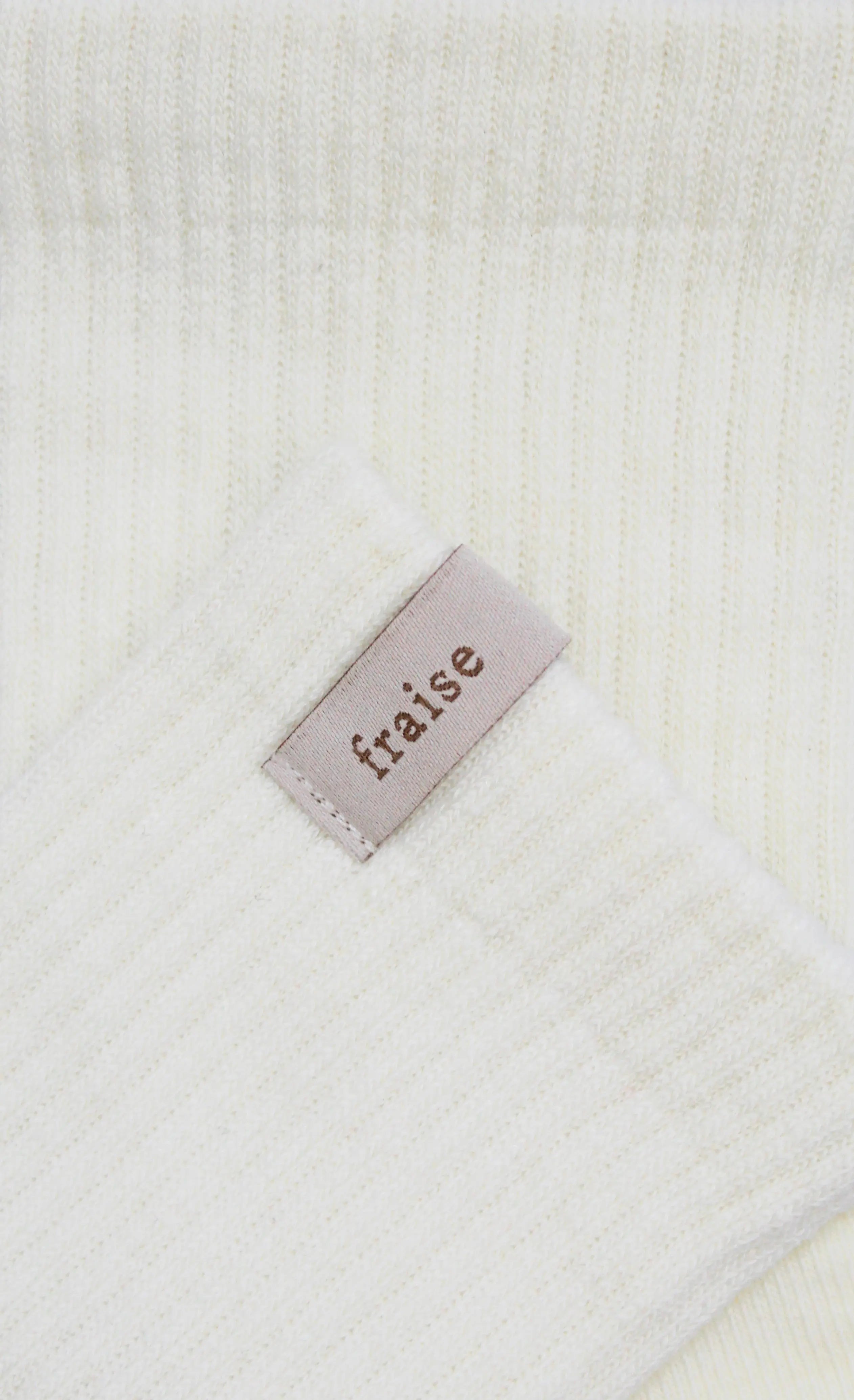 Pair of Fraise branded pilates grip socks in cream