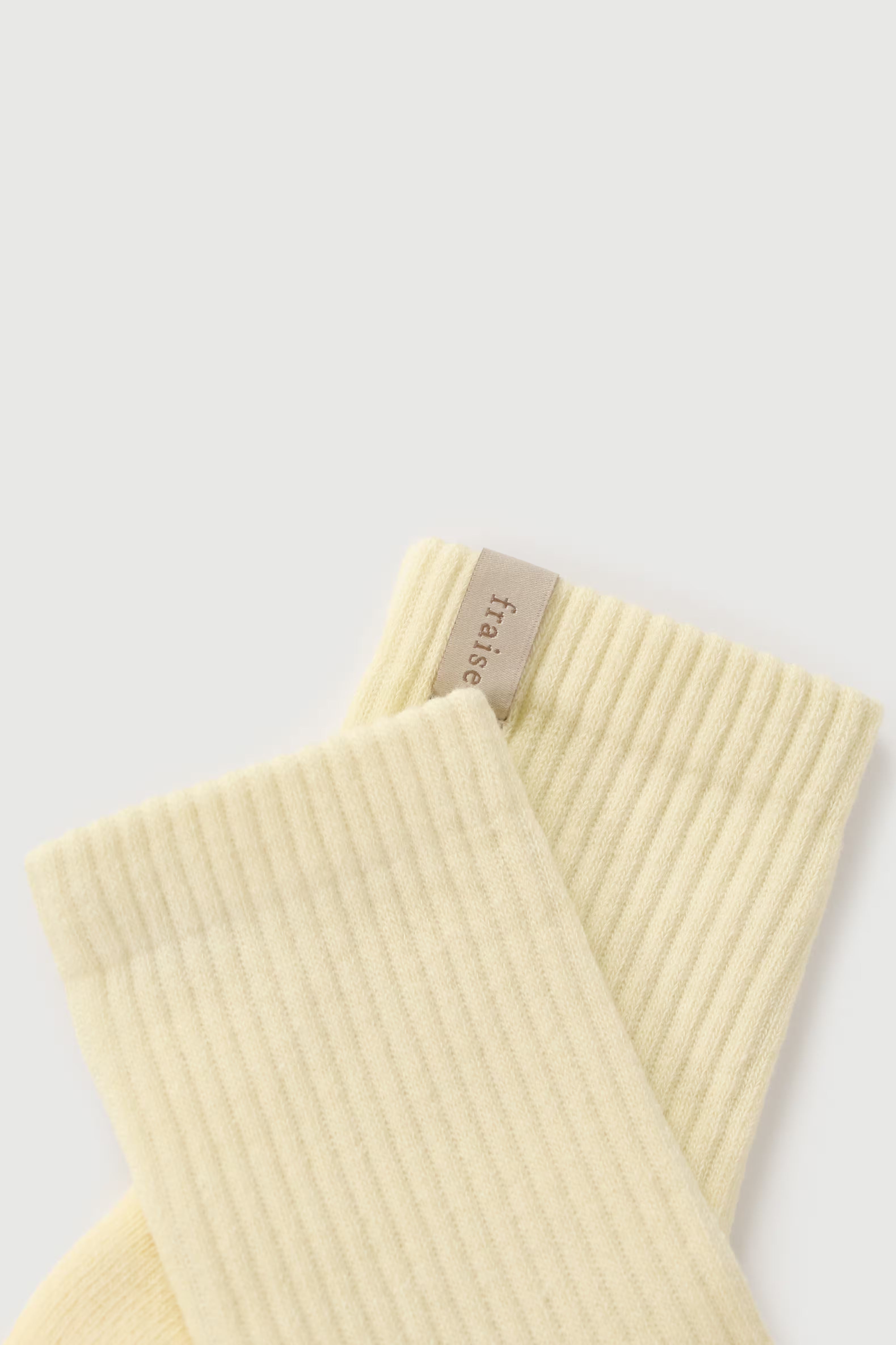 A yellow pilates grip sock from Fraise