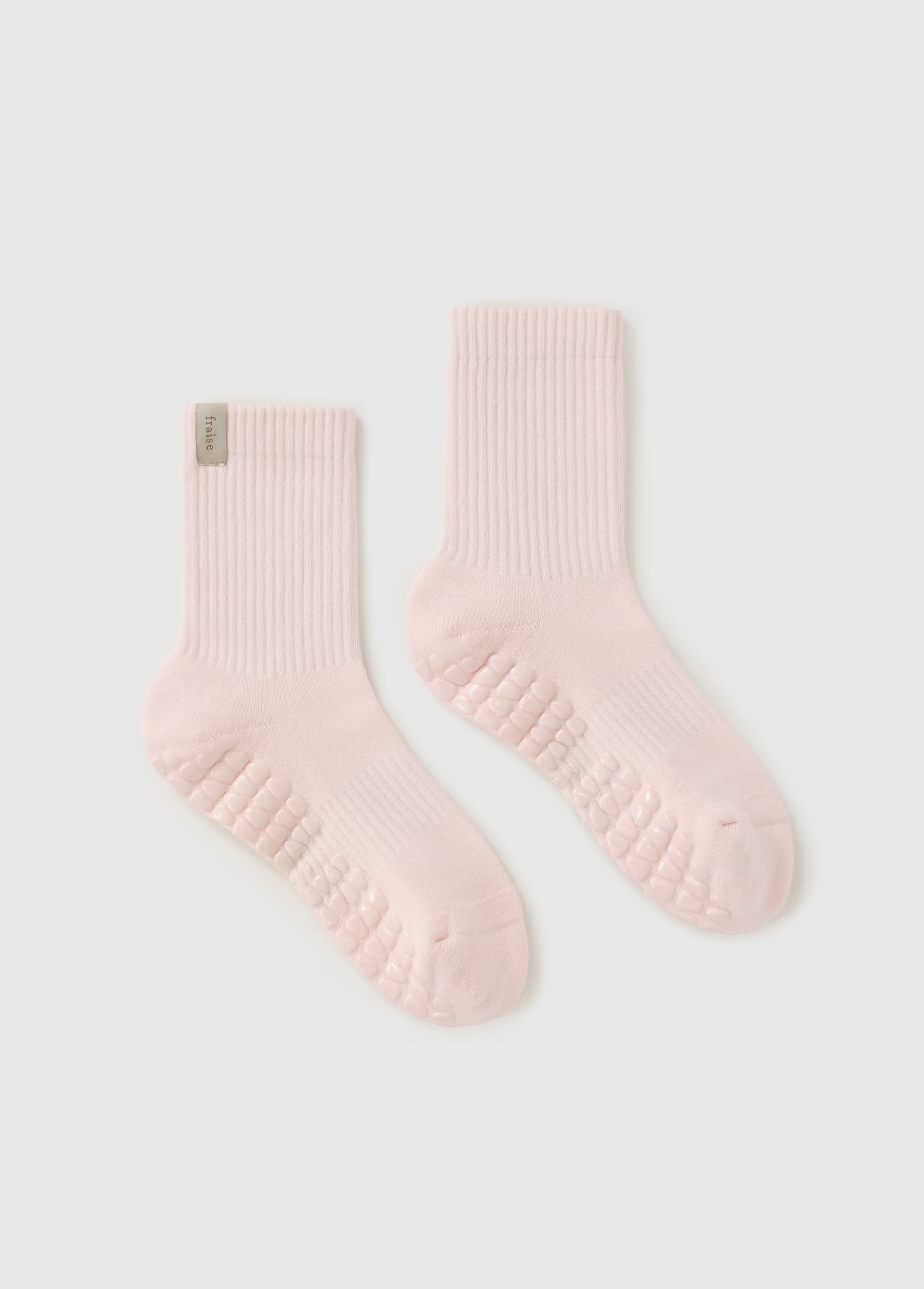 Pink pilates crew lenght grip socks from Fraise
