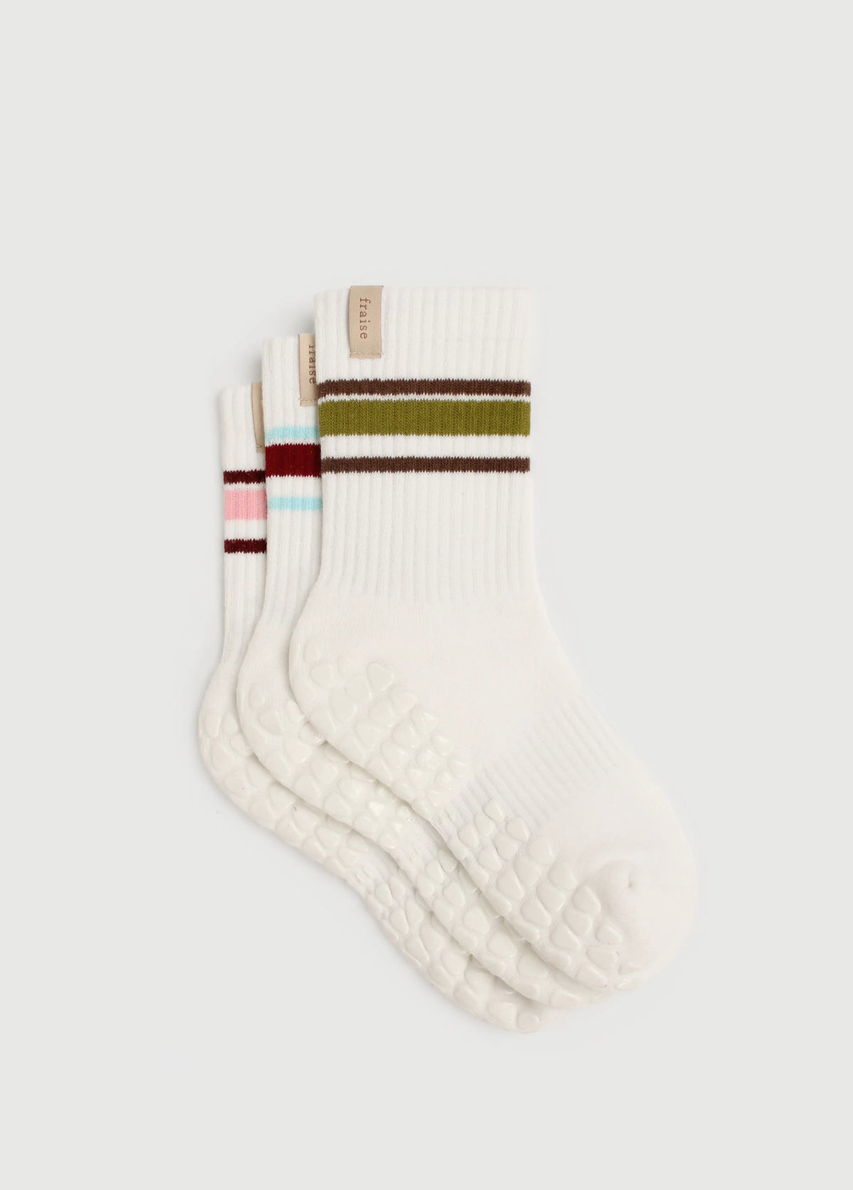 A set of three striped grip socks for pilates, yoga, barre, and maternity. They have a woven label with the brand Fraise on them.